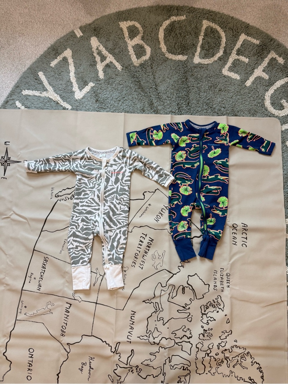 Bonds Zip Wondersuit Navy Footed One-Piece with Green Tropical Print